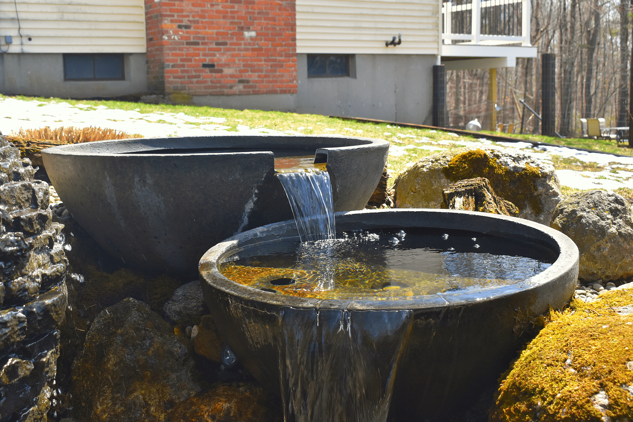 Garden water feature with cascading bowls.