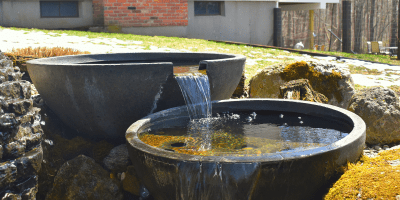 POURING BOWLS Garden water feature with cascading bowls.