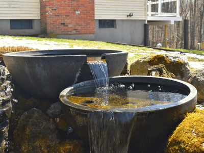 Garden water feature with cascading bowls.